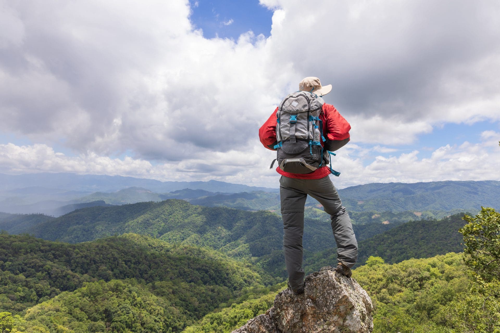 https://www.vecteezy.com/photo/9369978-young-happy-woman-with-backpack-standing-on-a-rock-and-looking-to-a-valley-below