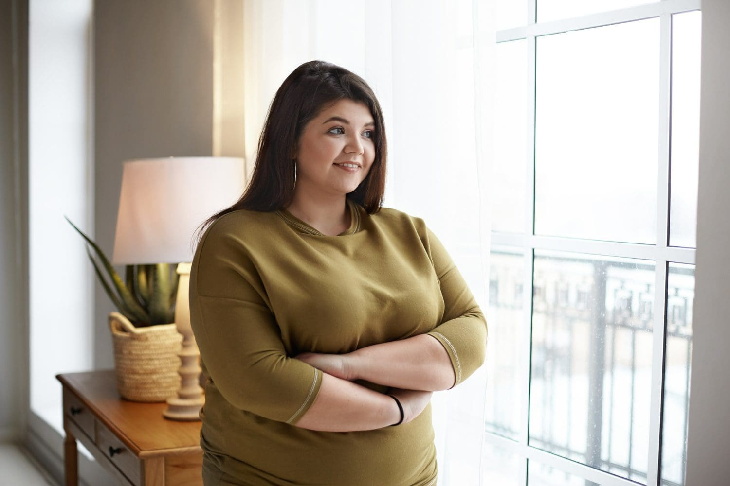 https://www.freepik.com/free-photo/cheerful-young-plus-size-overweight-woman-with-black-hair-chubby-cheeks-crossing-arms-her-chest-smiling-happily-standing-by-window-looking-outside-contemplating-beautiful-morning-view_11203167.htm#fromView=search&page=1&position=49&uuid=6a24be9b-e3ca-413a-9507-ed7df10823d9