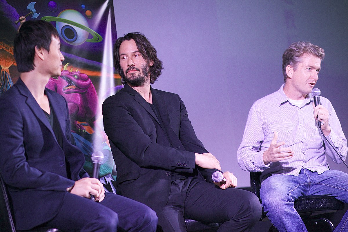 https://www.flickr.com/photos/annaustin/10615146086/ https://commons.wikimedia.org/wiki/File:Keanu_Reeves_%26_Tiger_Chen_%26_Tim_League_(10615146086).jpg