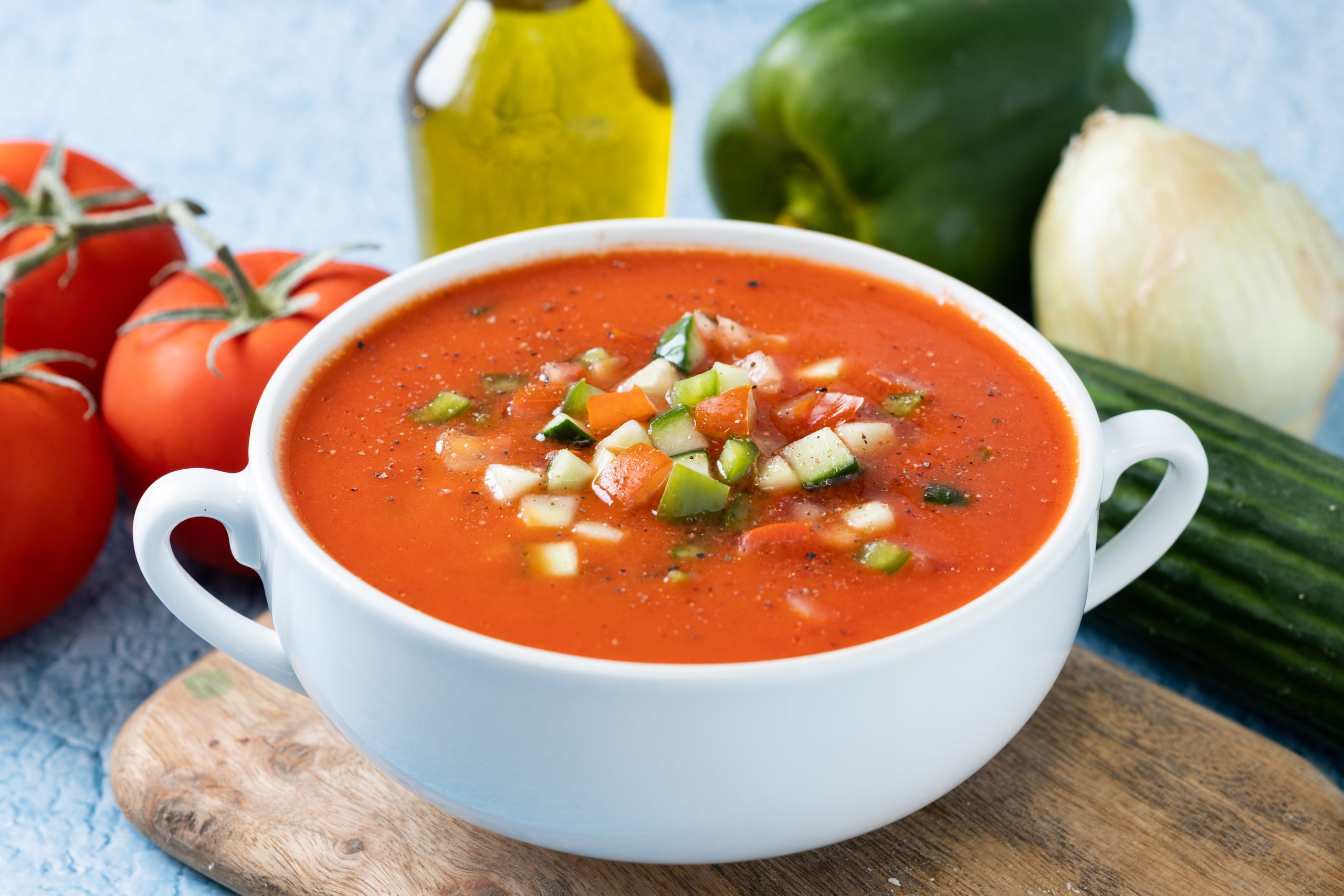 Traditional Spanish gazpacho soup in bowl on blue background https://www.freepik.com/free-photo/traditional-spanish-gazpacho-soup-bowl-blue-background_49395258.htm#fromView=search&page=1&position=2&uuid=cdcfca63-b9b2-4327-ae52-69ddf6ead9c4&query=gazpacho